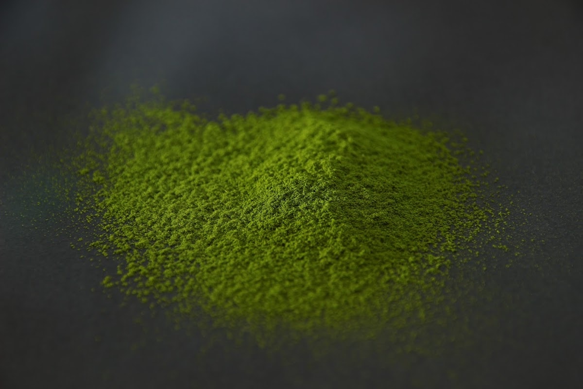 YAME 1 matcha powder heaped on a dark surface